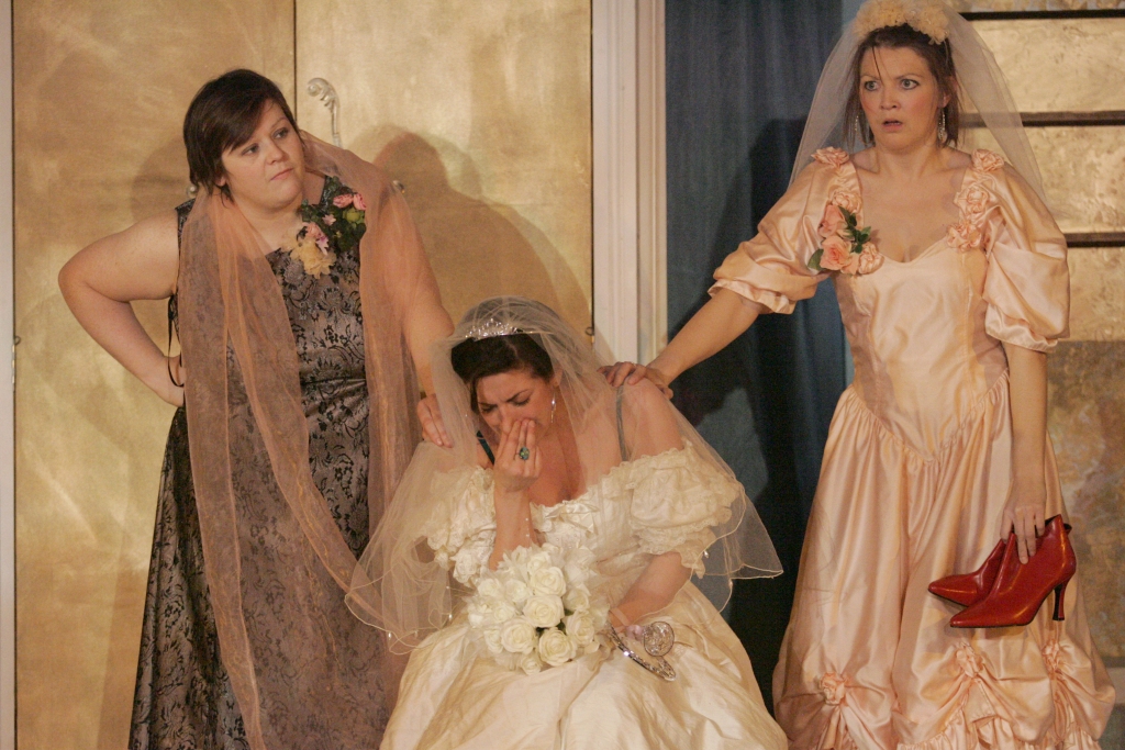A group of women, a bride, bridesmaid and wedding guest